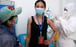 A medic in Wuhan, China injects a volunteer with a test vaccine as part of a clinical trial to battle the spread of coronavirus. Photo: DPA