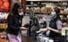 A cashier wears a face mask while serving a customer in Sydney on June 17, 2020. Photo: Reuters A cashier wears a face mask while serving a customer in Sydney on June 17, 2020. Photo: Reuters