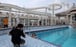 An internet show host poses in the swimming pool on the Explorer Dream cruise ship in Keelung, Taiwan, Cruise sailings have resumed, but with capacity reduced by two-thirds, no buffet service, and the on-board spa and casino closed. Photo: Reuters