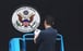 A worker removes the sign at the entrance to the US consulate in Chengdu, on July 25, following its closure in retaliation for a Chinse in the United States being shuttered. Photo: AFP