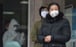 People wearing protective face masks to help stop the spread of a deadly virus which began in the city of Wuhan, China. Photo: AFP