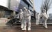 Workers wearing protective gear spray disinfectant in Daegu, South Korea, as cases of the new coronavirus surge. Photo: AP