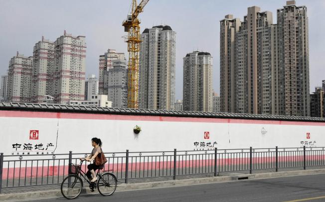 Shanghai banks won't approve mortgage applications where monthly repayments exceed 50 per cent of monthly income. Photo: EPA