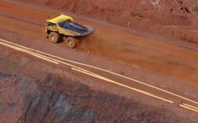 File photo of tipper truck leaving an iron ore mine. Reuters: TIM WIMBORNE 