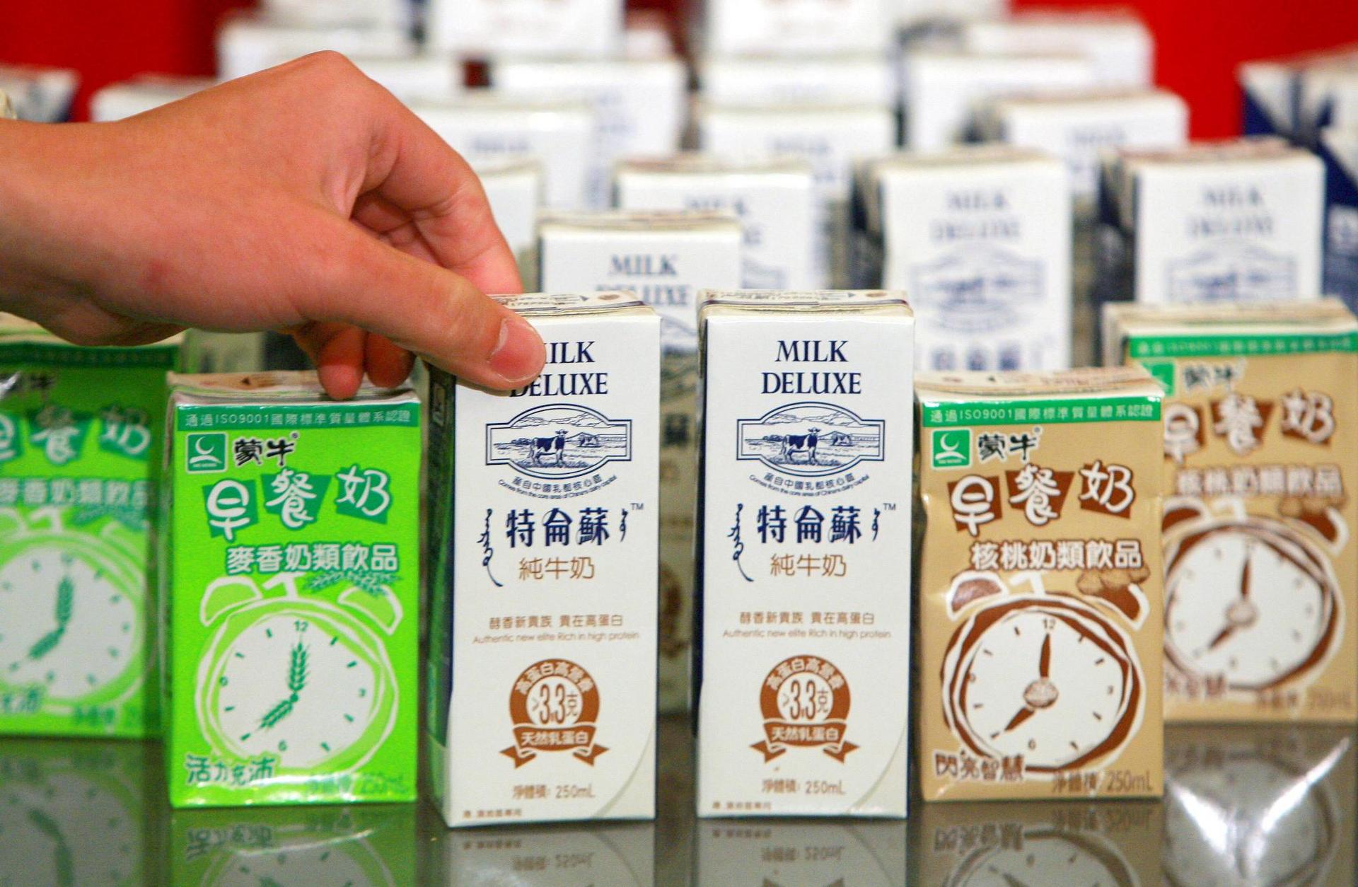 First-half earnings at China Mengniu Dairy fell to 645 million yuan, a result that the company partly attributed to a fall-out from quality-related scandals. Photo: EPA