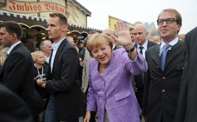 German Chancellor Angela Merkel arrives for the 'political morning pint' event at the Gillamoos fair in Abensberg, southern Germany. Photo: AFP 
