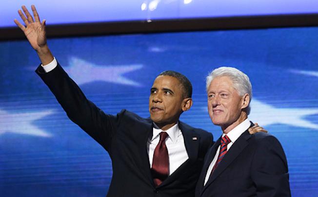 US President Barack Obama joins Bill Clinton on stage after the former president's rousing speech at the Democratic National Convention on Wednesday. Photo: AP