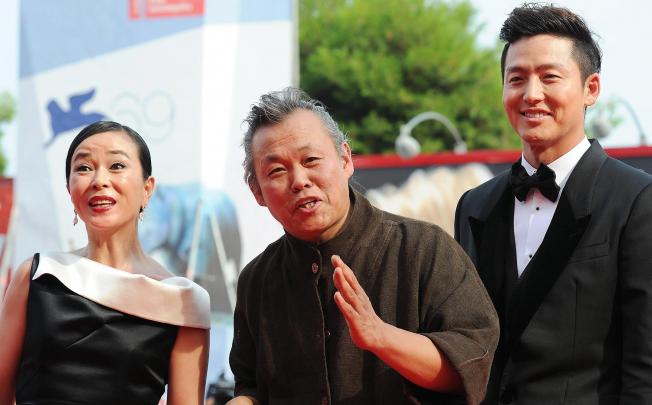 Director Kim Ki-duk (centre) attends the premiere of Pieta with actress Cho Min-soo and actor Lee Jung-jin in Venice on Tuesday. Photo: EPA
