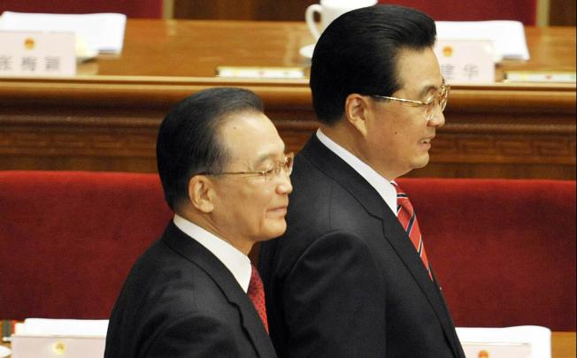 Premier Wen Jiabao (left) and President Hu Jintao make their way in for an opening session of the annual National People’s Congress in Beijing. Photo: AFP