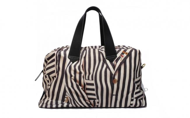 Travelling bag (HK$5,090) by Paul Smith