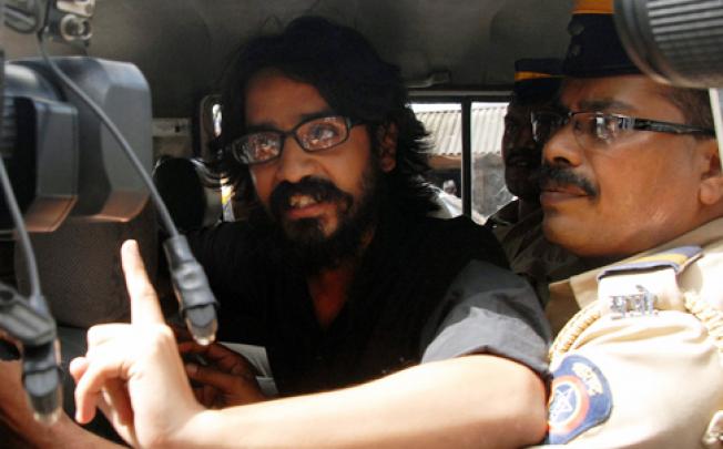 Indian cartoonist Aseem Trivedi is arrested in Mumbai under laws governing sedition. Photo: EPA