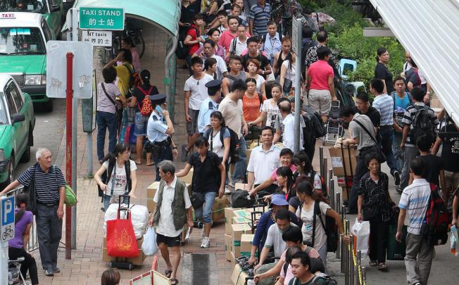 Travellers wait outside Sheung Shui station. Photo: Sam Tsang