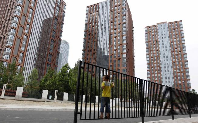 Newly built apartment blocks in Beijing. The central government is planning to stop building subsidised housing after 2015. Photo: Reuters