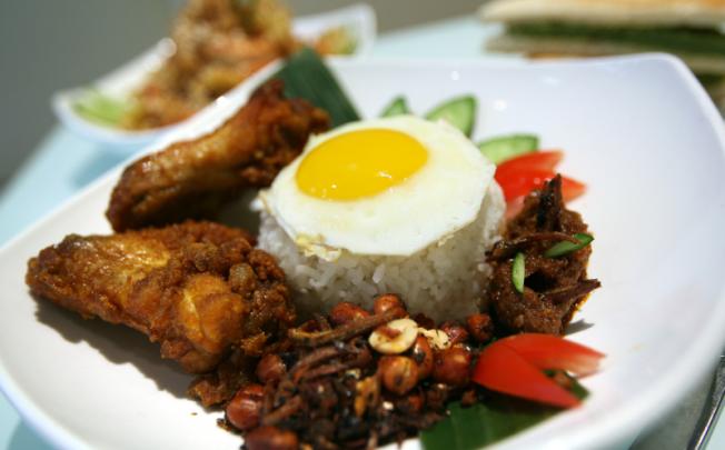 The most popular meal to start the day is nasi lemak, Malaysia's national dish.