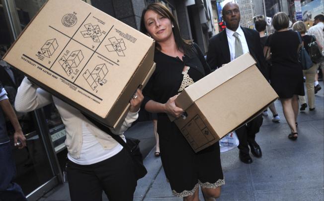 Women carrying boxes leave the Lehman Brothers headquarters in New York. The Australian arm of the 158-year-old investment bank bought Grange Securities in 2007.  