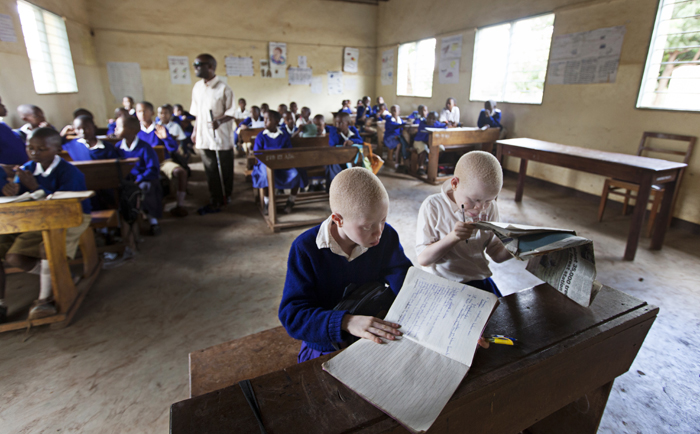 The Mwereni School in Moshi, in Tanzania's Kilimanjaro Region, caters to blind and albino students, whose desks are placed out of direct sunlight and close to the blackboard.