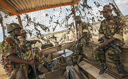 Soldiers of the Kenyan contingent serving with the African Union Mission in Somalia sit in a watch tower in Dhobley, southern Somalia. Photo: EPA