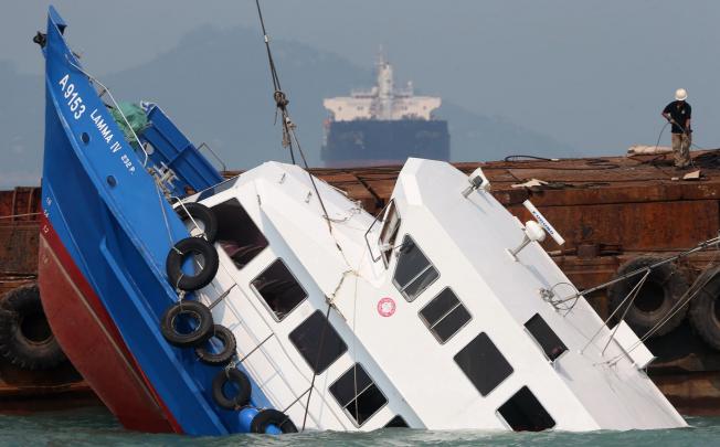 The Lamma IV which was partially sunk in the waters off Lamma Island is lifted up from the sea yesterday. Photo: Sam Tsang