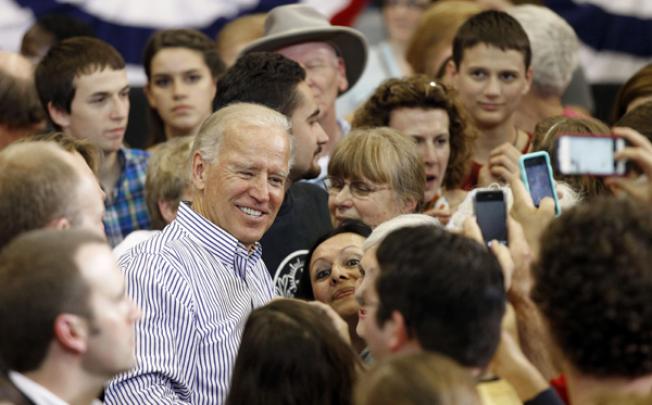 Vice President Joe Biden poses for photos with supporters during a campaign event in Asheville, North Carolina, on Tuesday. Photo: AP