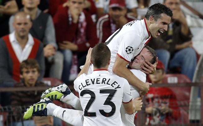 Van Persie celebrates his second goal against CFR Cluj in Romania. Photo: AP