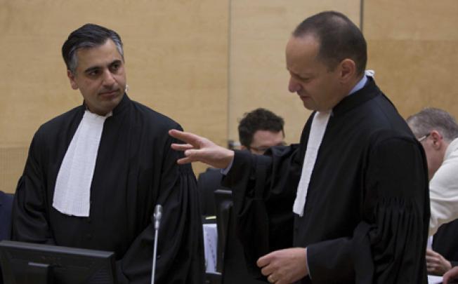 Payam Akhavan (left) and Phillippe Sands in the International Criminal Court before a public hearing on Libya's challenge to the admissibility of the case against Saif al-Islam Gaddafi in The Hague on Tuesday. Photo: EPA