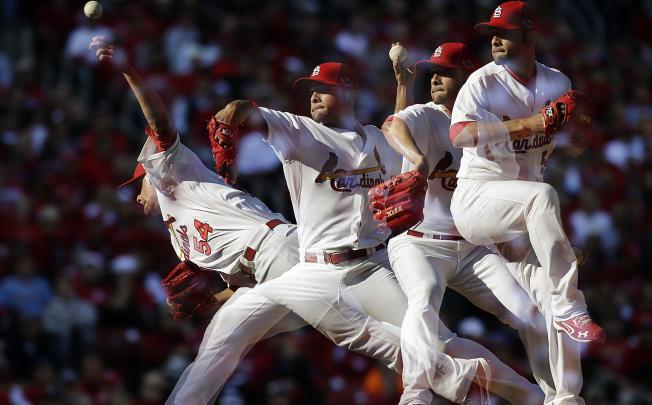 In this multiple exposure photo, the St Louis Cardinals’ Jaime Garcia delivers a pitch against the Washington Nationals. Photo: AP