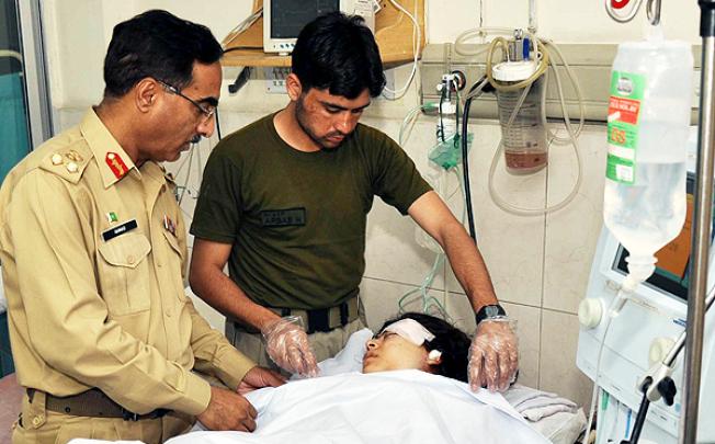 Army doctors in Peshawar treat teenage activist Malala Yousafzai after she was shot by the Taliban in the Swat Valley on Tuesday. Photo: EPA