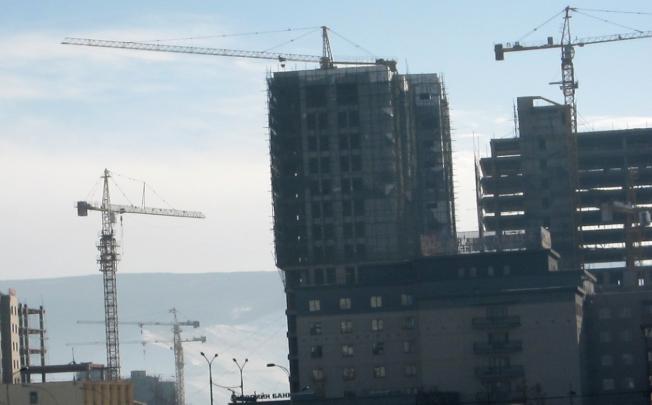 Cranes dot the skyline in Ulan Bator, where double-digit economic growth has helped the resource-rich country weather the global financial crisis. Photo: SCMP  