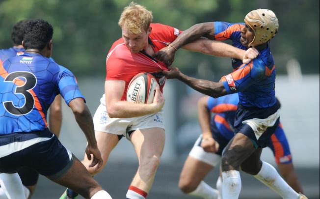 Jamie Hood stays on his feet during Hong Kong's 43-0 victory over India in Mumbai. Hong Kong are in the Cup quarters. Photo: SCMP