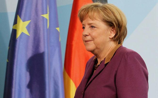 Angela Merkel prepares to deliver her statement on the Peace Prize. Photo: EPA