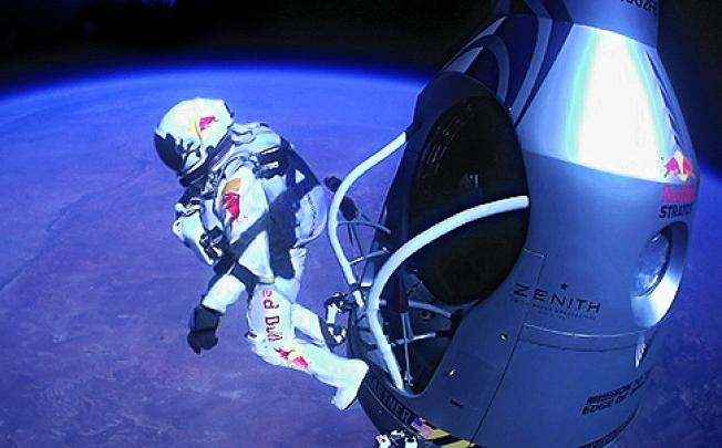 Felix Baumgartner jumps out of his capsule from more than 39 kilometres above the earth. Photo: AP 