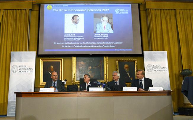 Staffan Normark of the Royal Swedish Academy of Sciences announces the winner of the Nobel Prize in Economic Sciences on Wednesday. Photo: AP