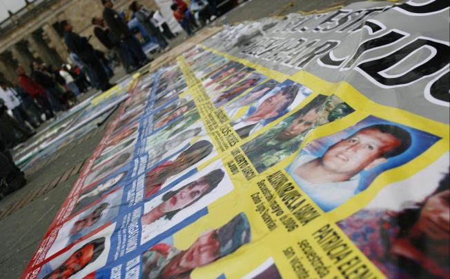 Relatives of victims kidnapped by Farc (pictured above) campaign against an amnesty for the rebels in the peace process. Photo: Reuters