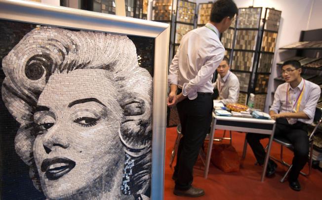 A mosaic image of Marilyn Monroe on display at the Canton Fair in Guangzhou. The mood of the fair activities is mixed. Photo: NYT