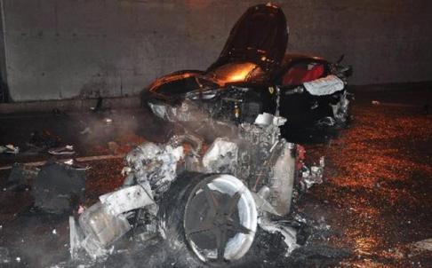 The smouldering remains of Ferrari 430 are scattered across Beijing's northern 4th Ring Road in this photo taken after a fatal accident on March 18, 2012