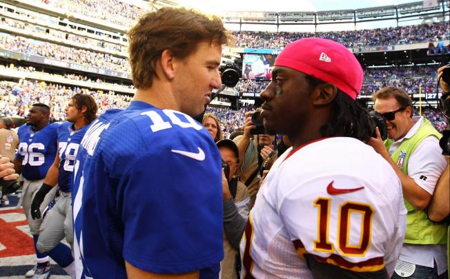 Giants' Eli Manning and Redskins' Robert Griffin III. Photo: AFP