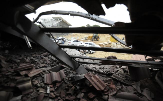 A damaged house in Netiv Haasara, Israel, after a rocket attack from the neighbouring Gaza Strip yesterday. Photo: AFP
