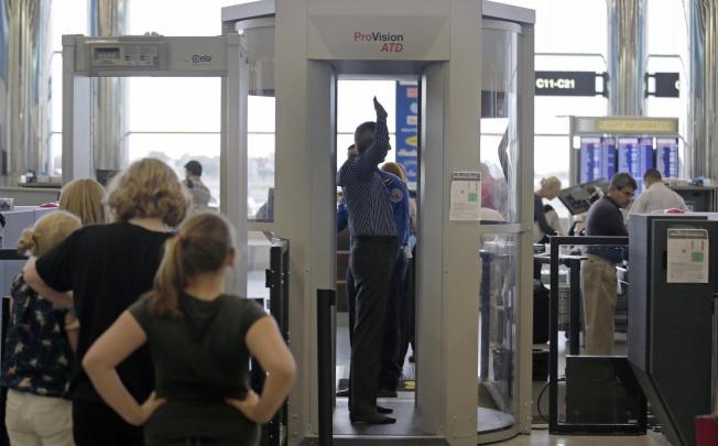 People go through Logan Airport's new scanner in Boston. Photo: AP