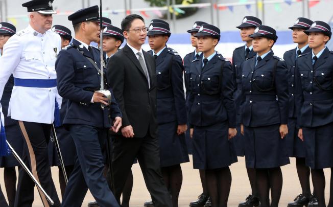 Justice minister Rimsky Yuen Kwok-keung inspects a passing-out parade of recruits at the Police College yesterday. Photo: Sam Tsang