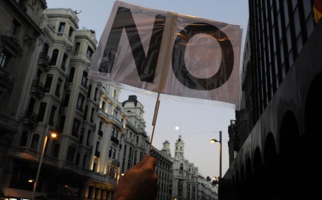 Demonstrators in Madrid oppose the government's hefty spending cuts. Photo: AFP