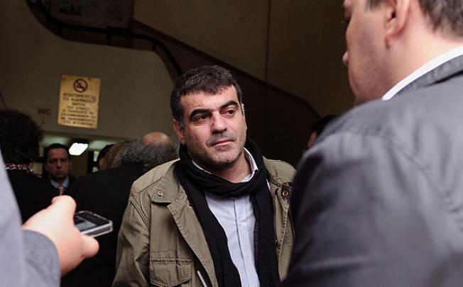 Costas Vaxevanis speaks to journalists at an Athens courthouse. Photo: AFP 