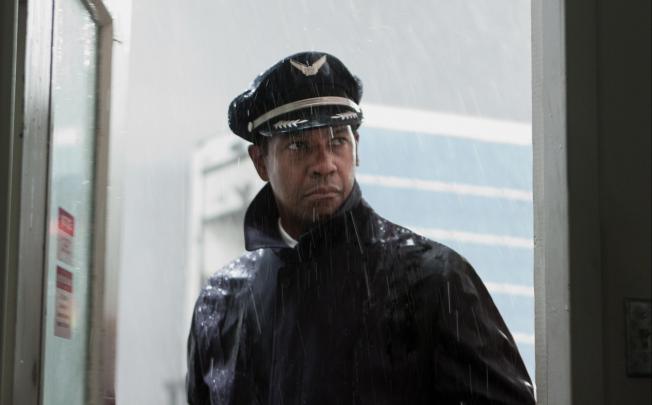 Flight features Denzel Washington portraying Whip Whitaker, a whiz in the cockpit despite being inebriated and drugged up much of the time. Photo: AP
