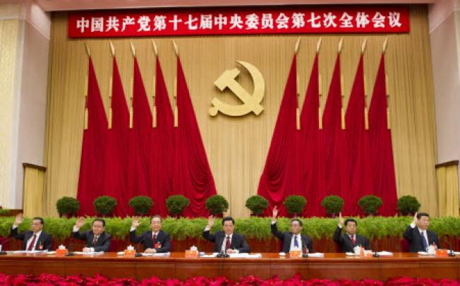 Chinese senior leaders Hu Jintao (centre) Wu Bangguo (third right) Wen Jiabao (third left) Jia Qinglin (second right) Li Changchun (second left) Xi Jinping (right) Li Keqiang (left) at the Seventh Plenary Session in Beijing. Photo: AP
