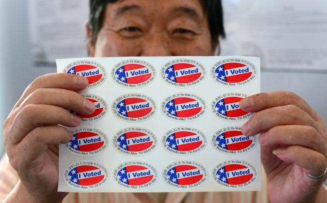 "I Voted" stickers were printed in multiple languages, as candidates tried to woo support from crucial minority groups. Photo: AFP