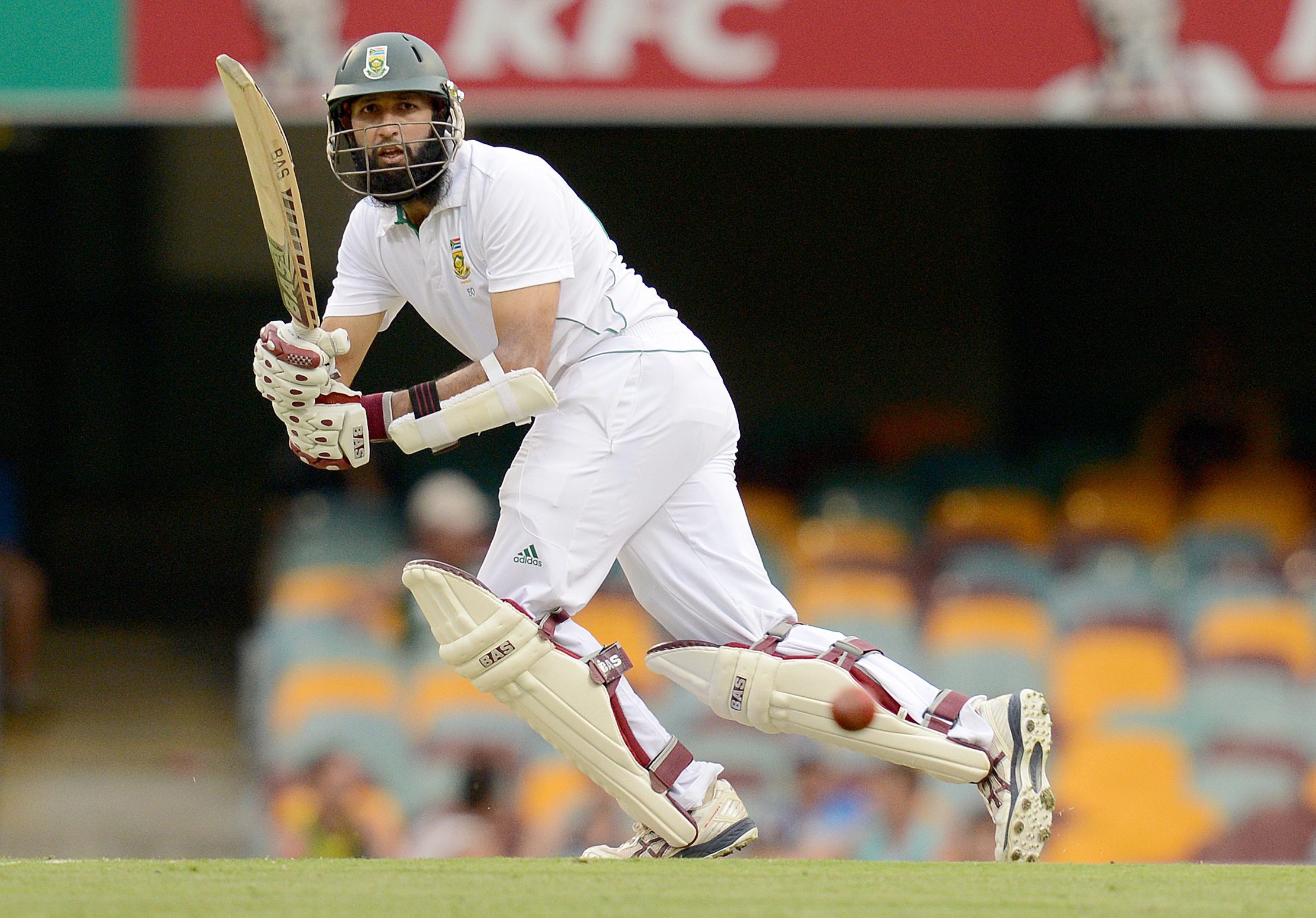 South African cricketer Hashim Amla plays a shot on the first day of the first test against Australia at the Gabba in Brisbane. Photo: EPA