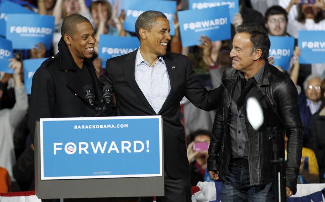 Barack Obama (centre) with supporting celebrities Jay-Z (left) and Bruce Springsteen at a campaign event in Columbus, Ohio.