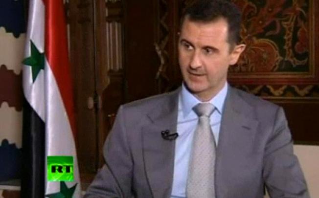 Syrian President Bashar Assad spoke with Russia Today and vowed to "live in Syria and die in Syria". Photo: AP