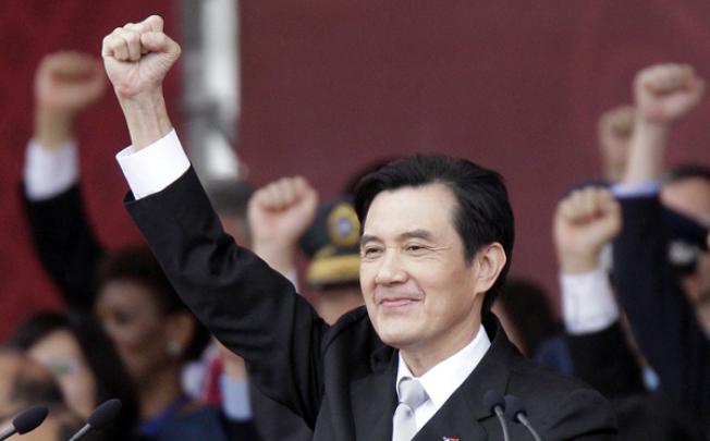 Taiwan's President Ma Ying-jeou raises his fist during National Day celebrations in front of the presidential office in Taipei on October 10. Photo: Reuters