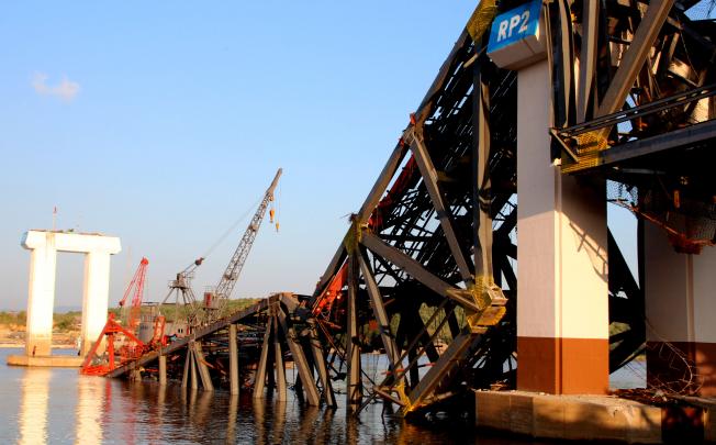 The collapsed bridge over the Irrawaddy River, still under construction, after the earthquake. Photo: Xinhua