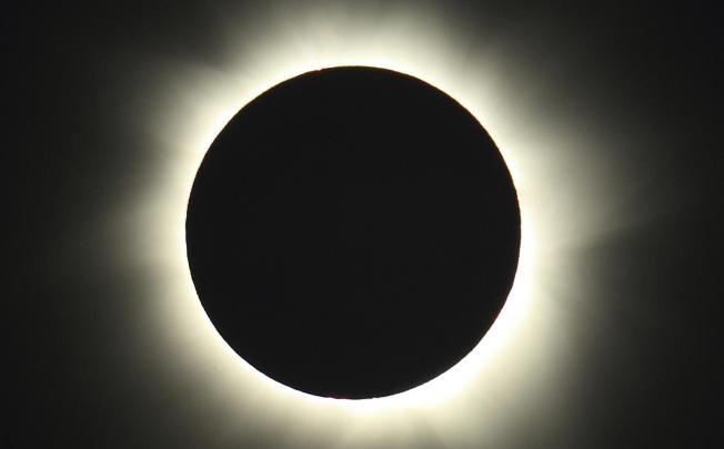 Starting just after dawn, the eclipse cast a shadow 150 kilometres long. Photo: AP/Tourism Queensland